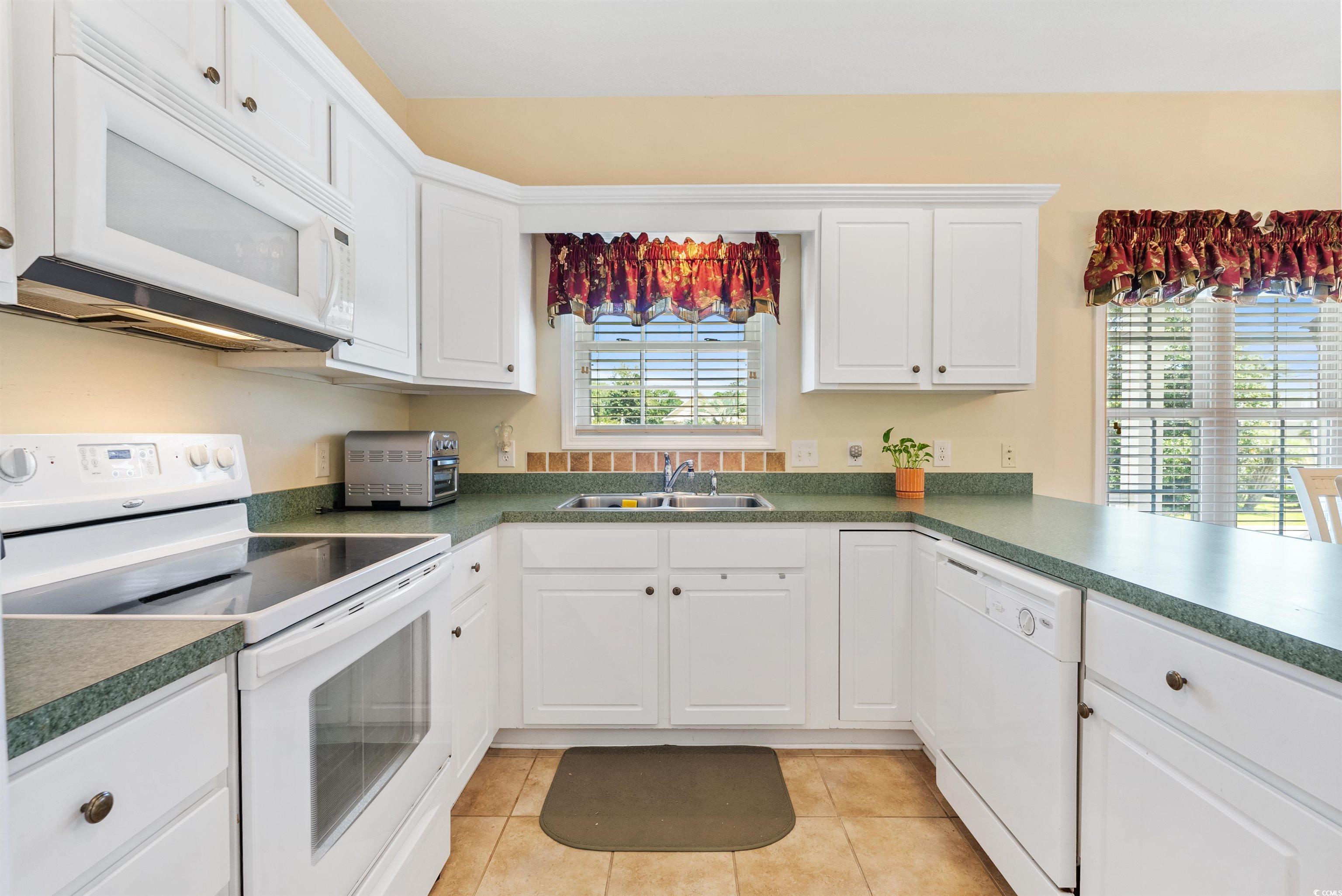 513 Rainbow Drive Murrells Inlet, SC 29576 - Photo 8 of 29 Kitchen with light tile patterned floors, white ap