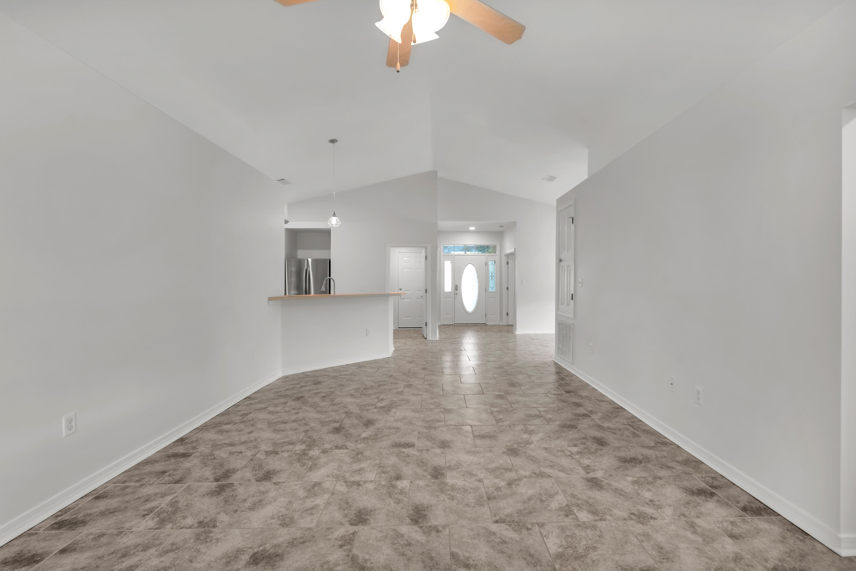161 South Harborview Road Santa Rosa Beach, FL 32459 - Photo 11 of 39 a view of a big room with windows and chandelier fan