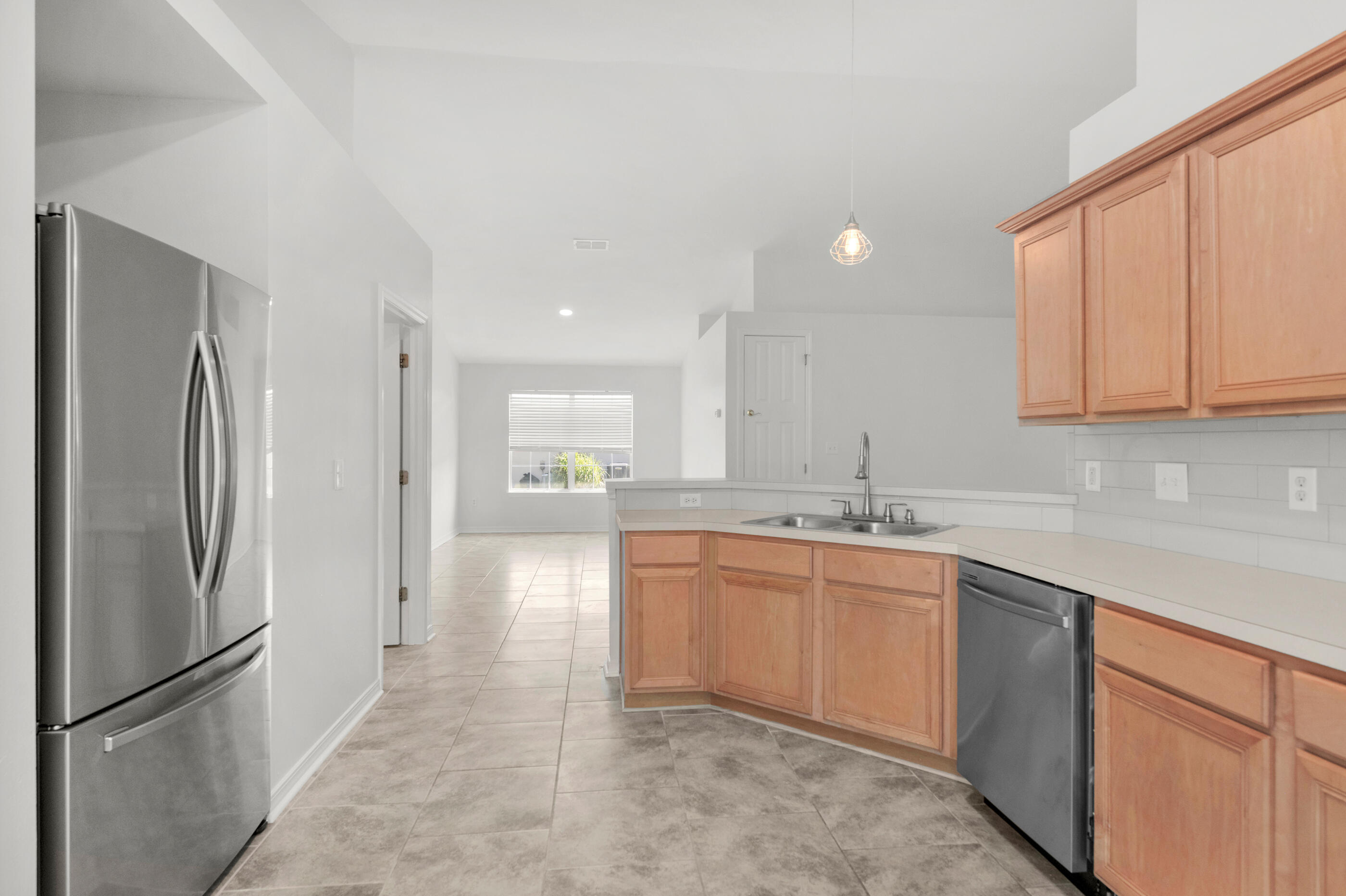 161 South Harborview Road Santa Rosa Beach, FL 32459 - Photo 17 of 39 a kitchen with stainless steel appliances granite countertop a refrigerator and a sink