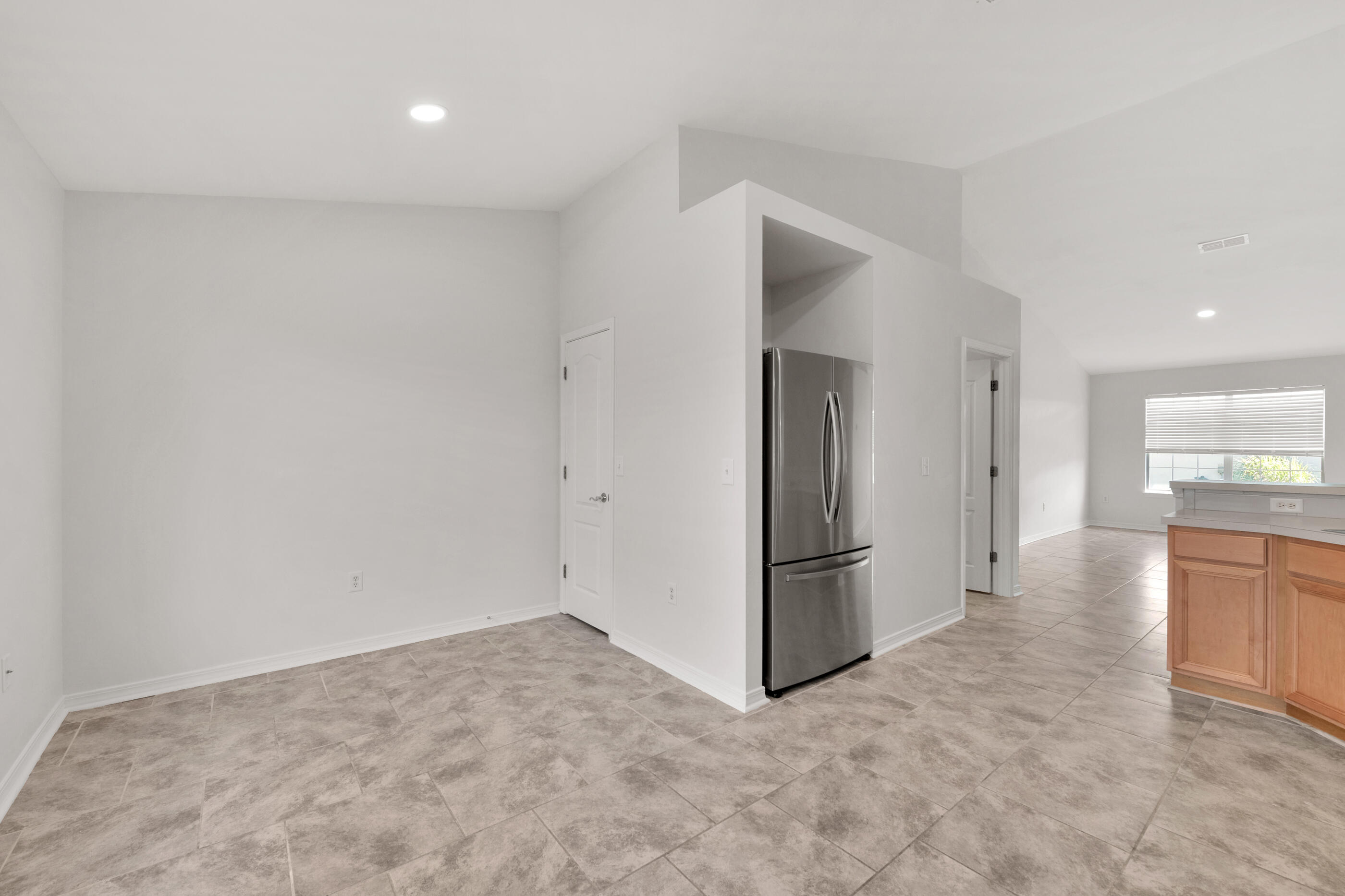 161 South Harborview Road Santa Rosa Beach, FL 32459 - Photo 18 of 39 an empty room with kitchen and a refrigerator
