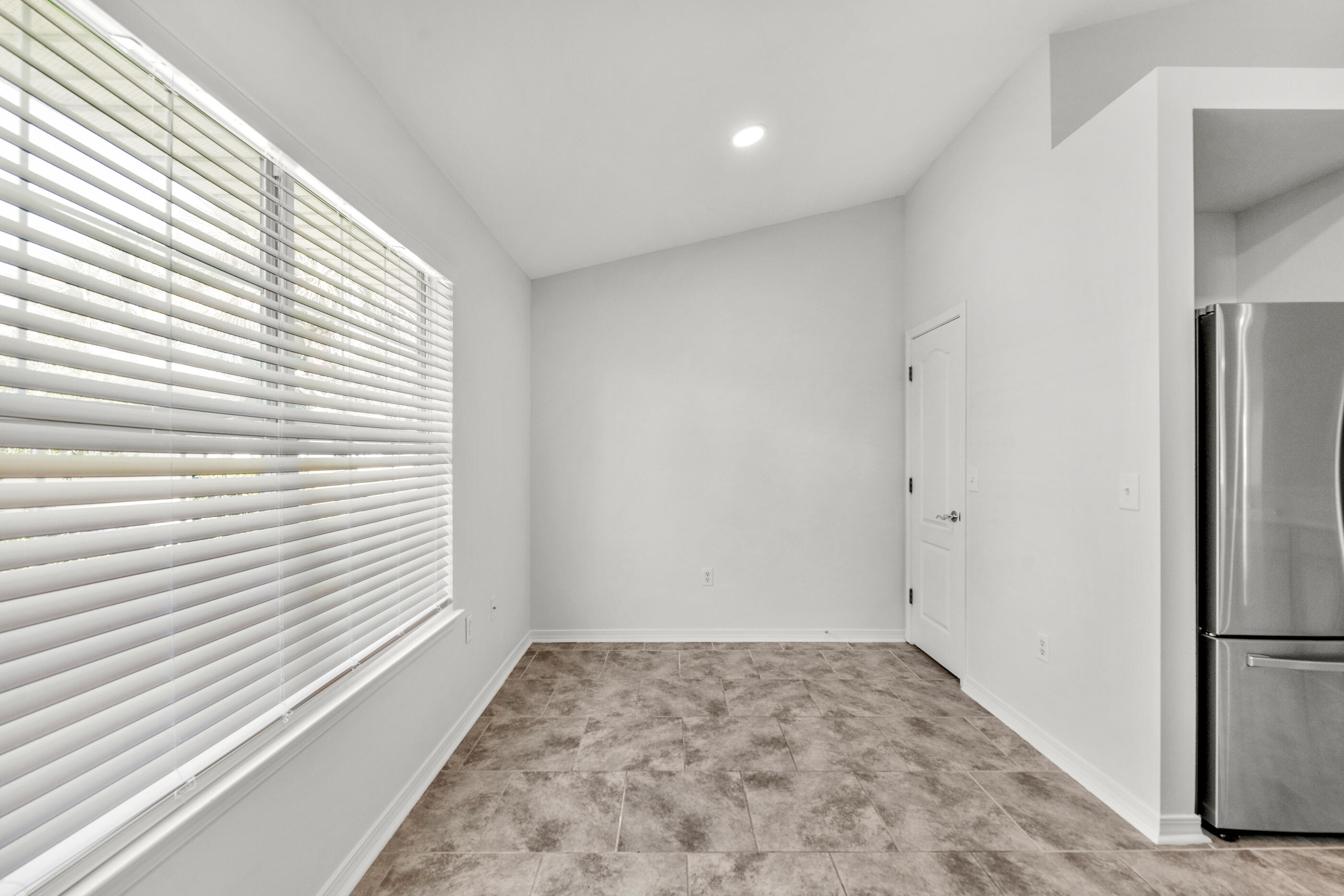 161 South Harborview Road Santa Rosa Beach, FL 32459 - Photo 19 of 39 a view of a room with a refrigerator and a window