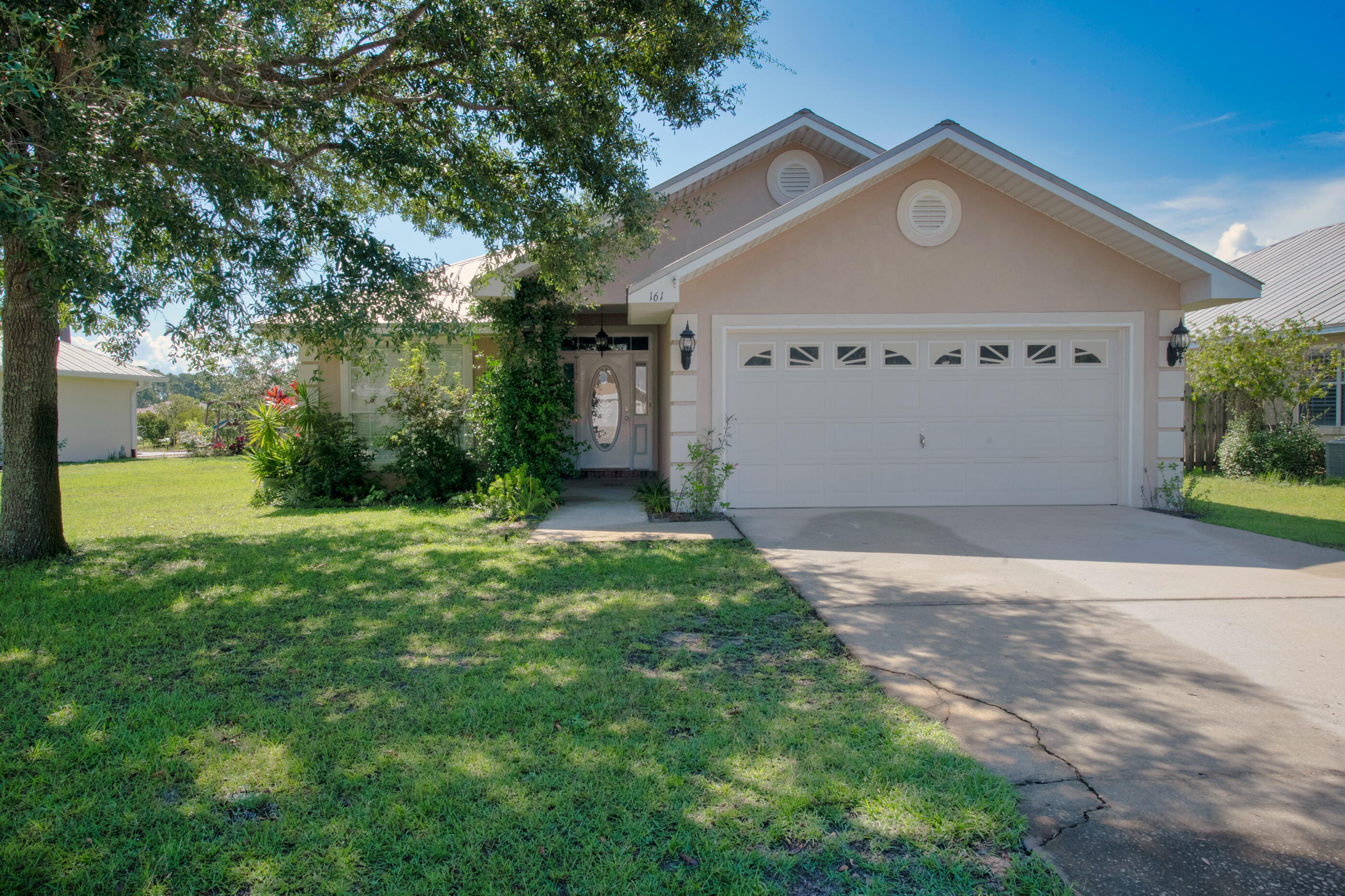 161 South Harborview Road Santa Rosa Beach, FL 32459 - Photo 2 of 39 a view of a wooden house with a yard