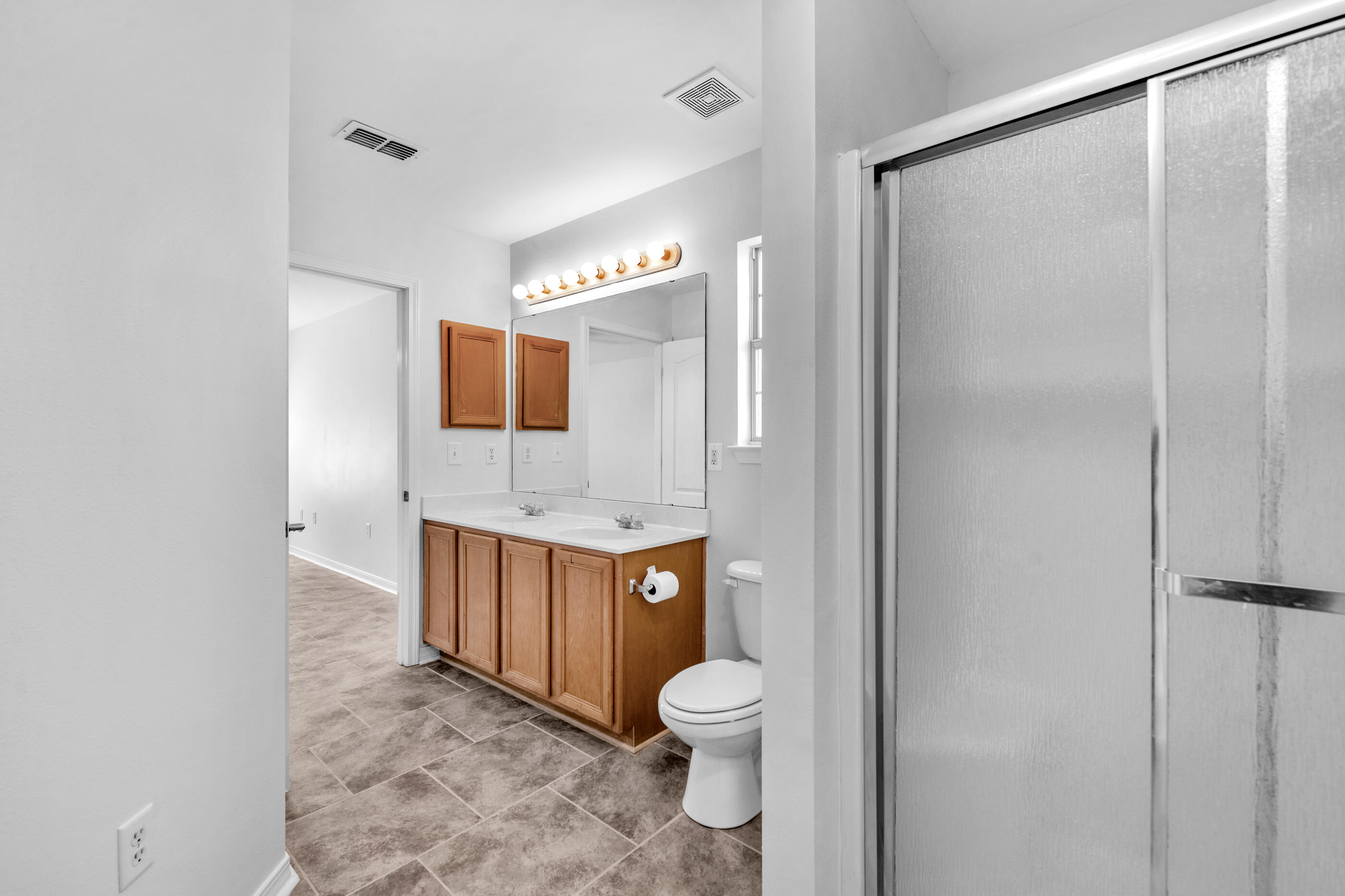 161 South Harborview Road Santa Rosa Beach, FL 32459 - Photo 25 of 39 a bathroom with a toilet a sink and mirror