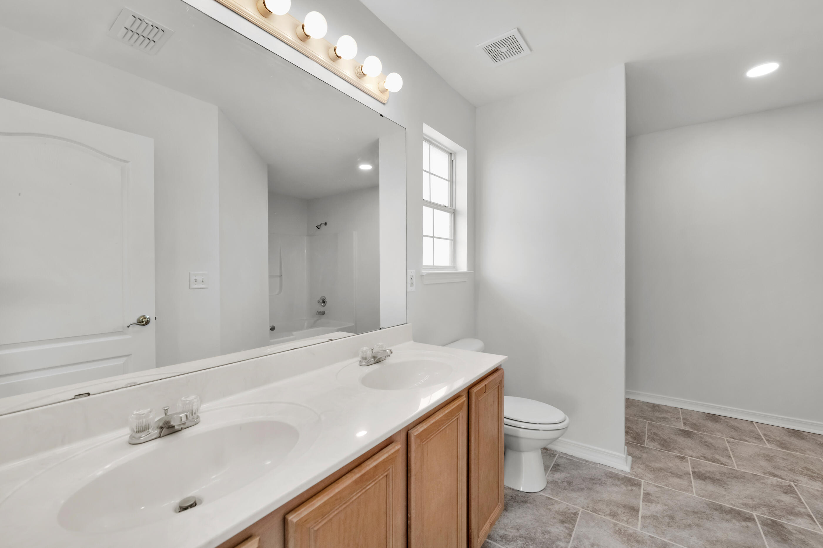 161 South Harborview Road Santa Rosa Beach, FL 32459 - Photo 27 of 39 a view of bathroom with a sink mirror and toilet