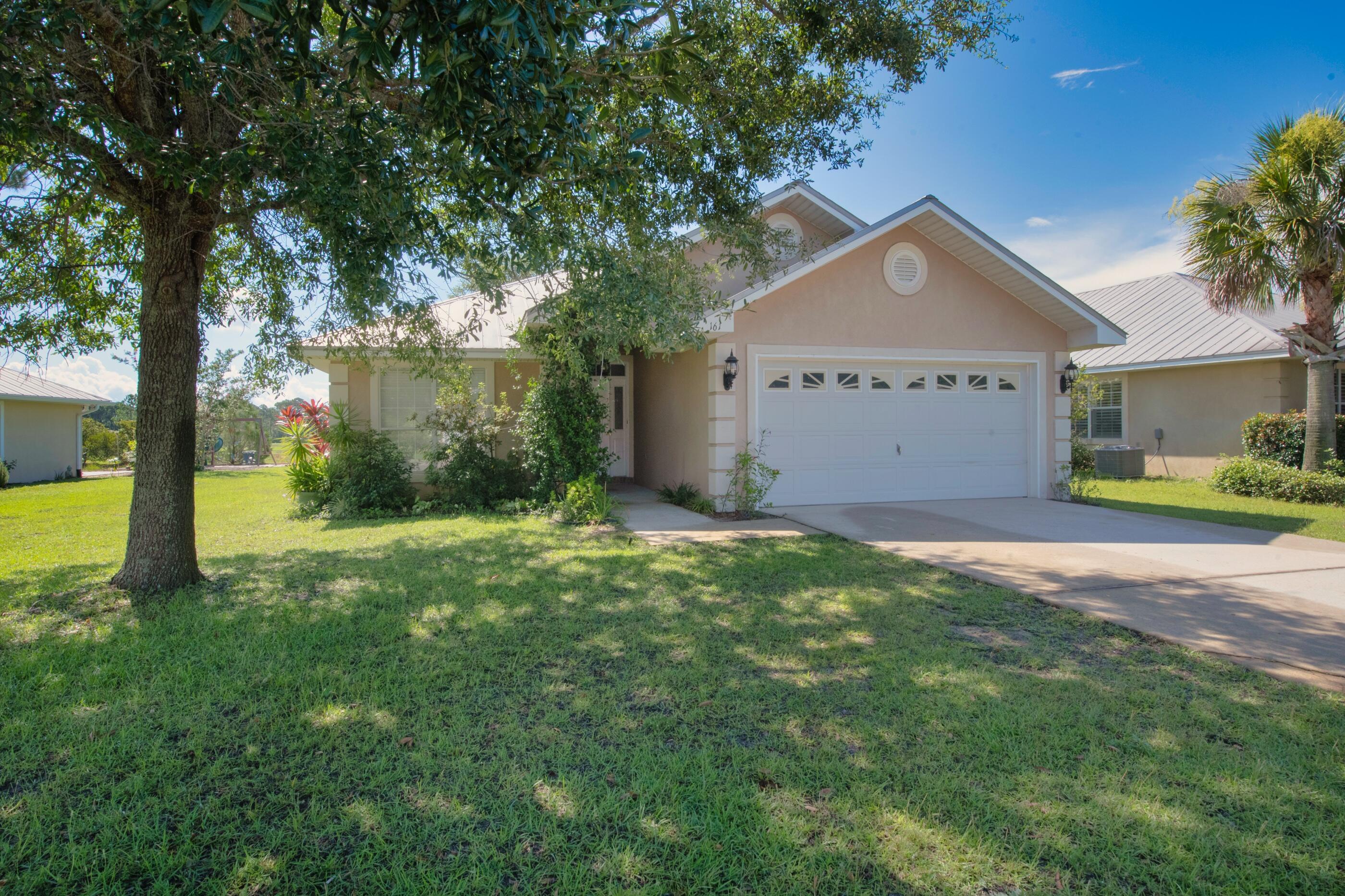 161 South Harborview Road Santa Rosa Beach, FL 32459 - Photo 3 of 39 a view of a house with a yard