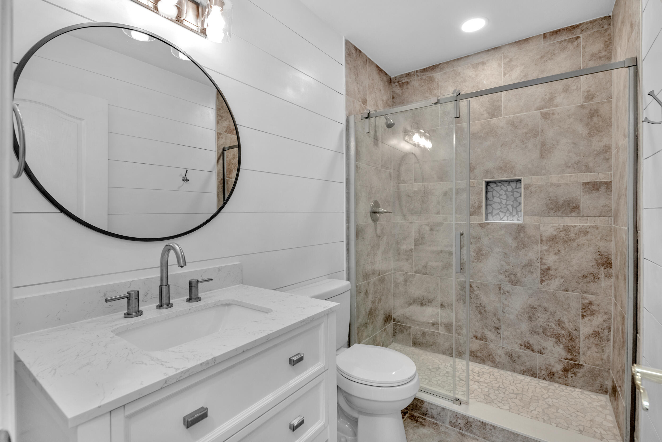 161 South Harborview Road Santa Rosa Beach, FL 32459 - Photo 31 of 39 a bathroom with a sink a toilet and a mirror