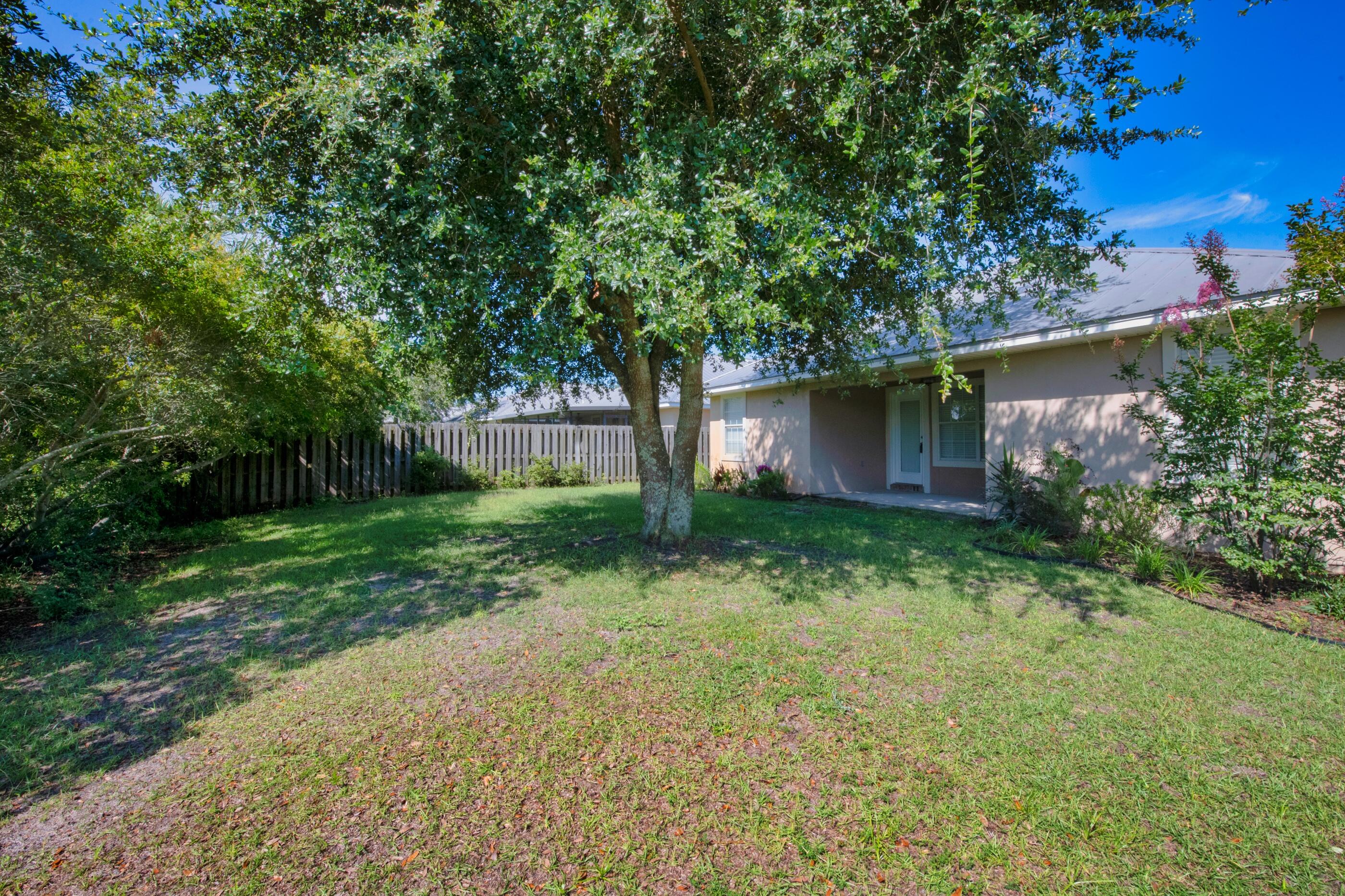 161 South Harborview Road Santa Rosa Beach, FL 32459 - Photo 33 of 39 a front view of a house with garden