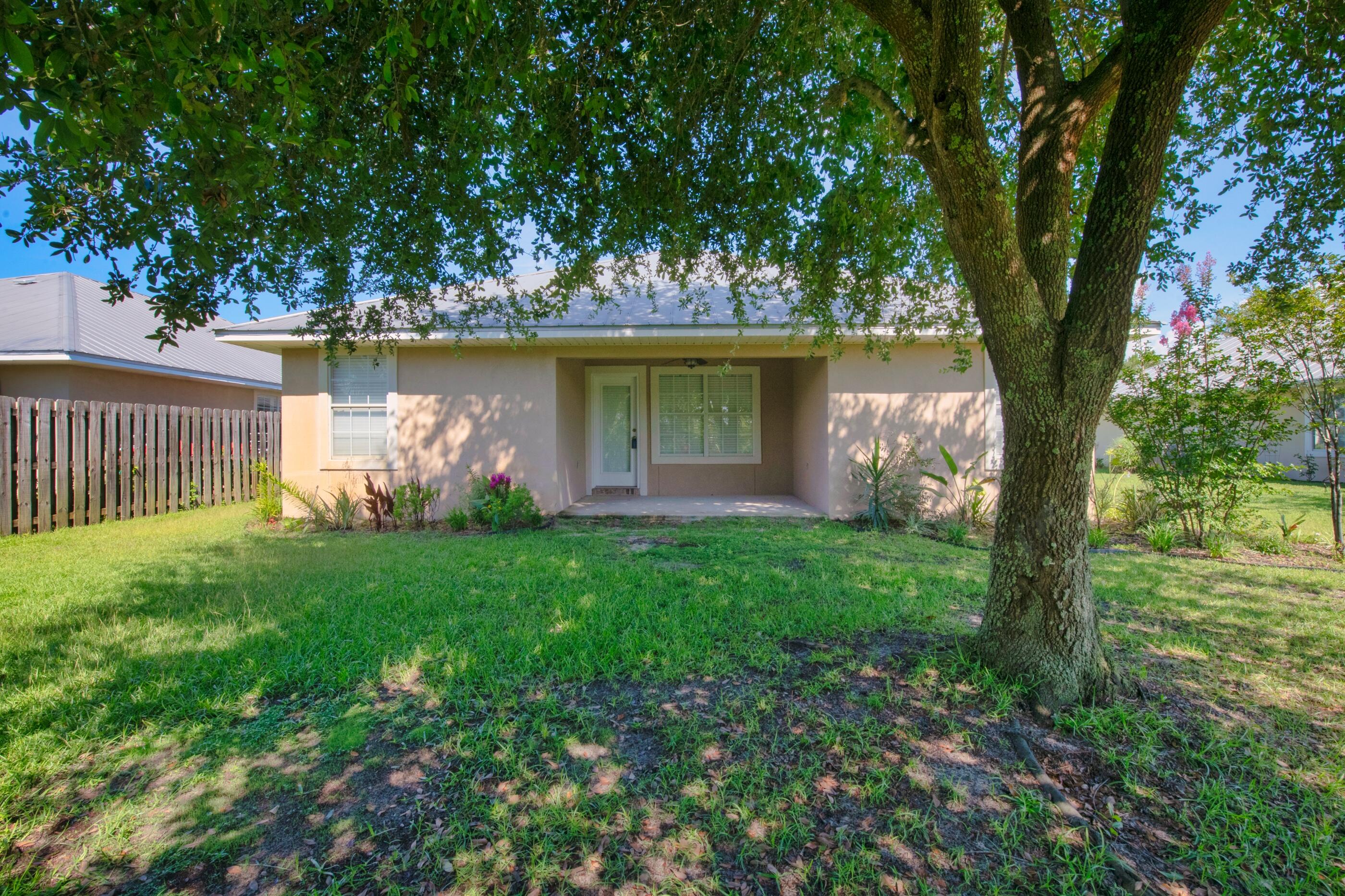 161 South Harborview Road Santa Rosa Beach, FL 32459 - Photo 36 of 39 a front view of a house with garden