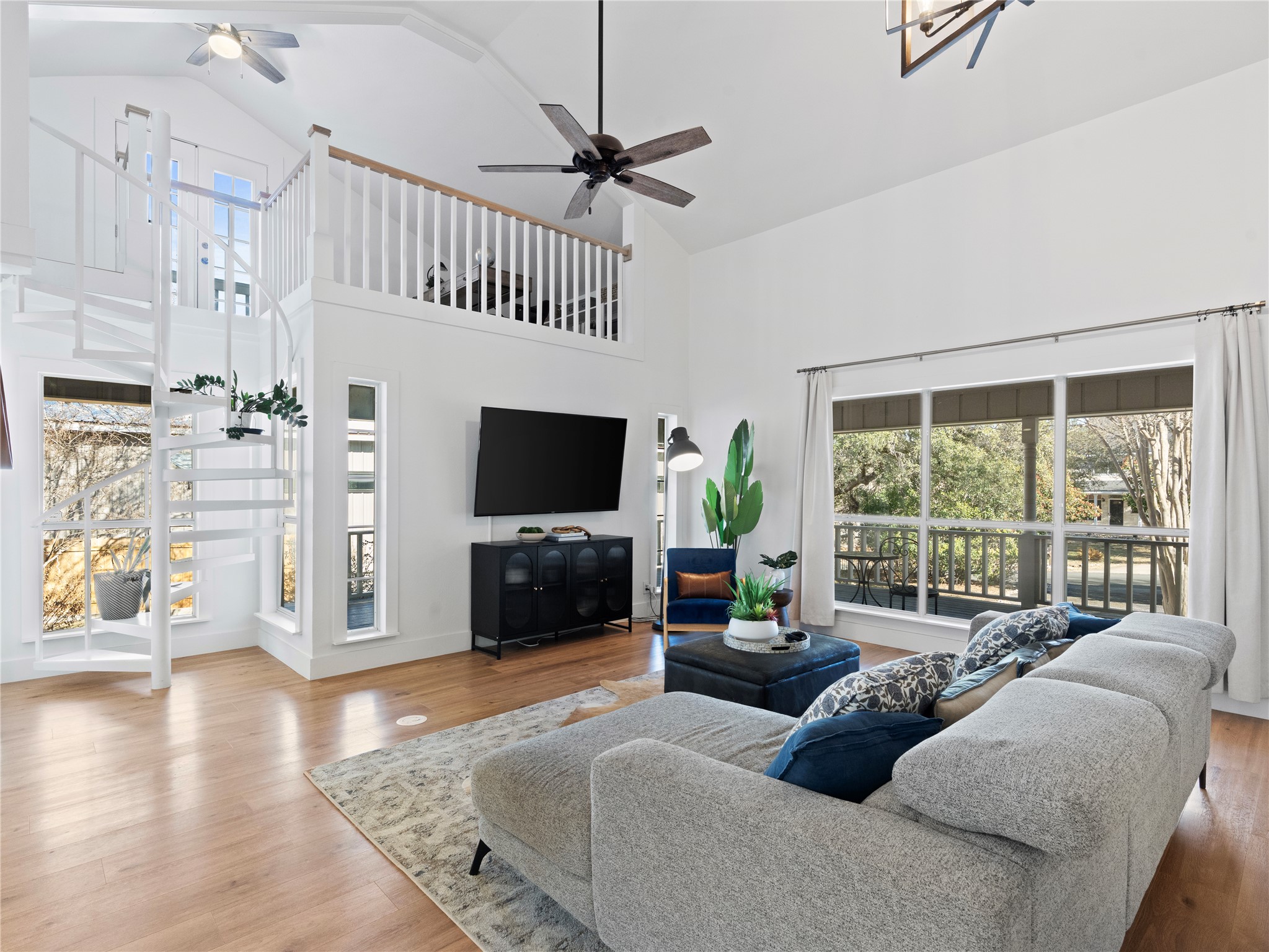 5108 Sioux Lane Austin, TX 78734 - Photo 12 of 35 a living room with furniture a flat screen tv and a large window