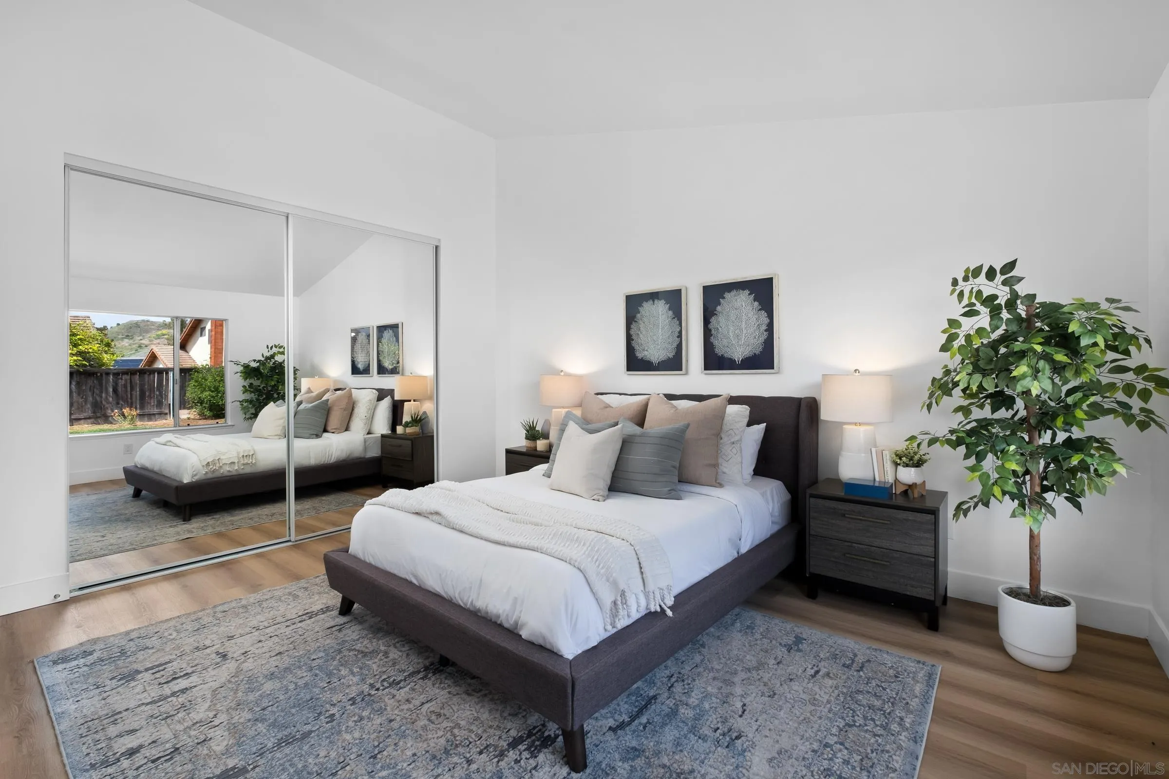 4436 Point Vicente Oceanside, CA 92058 - Photo 12 of 23 a bedroom with a large bed and a couch