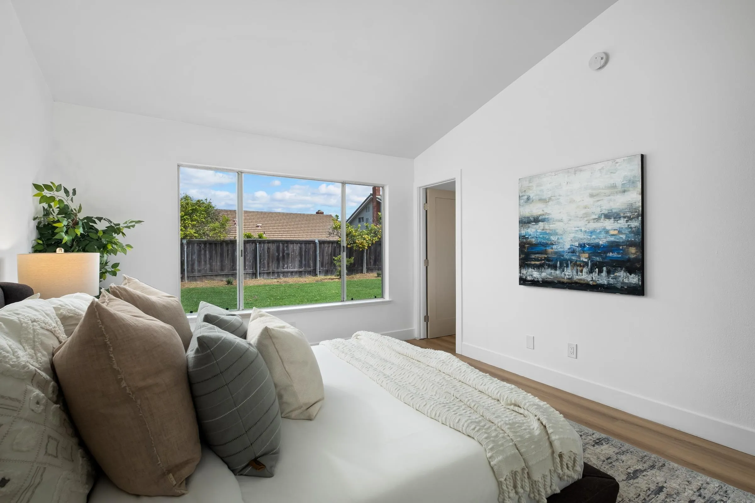 4436 Point Vicente Oceanside, CA 92058 - Photo 13 of 23 a bed sitting in a bedroom next to a window