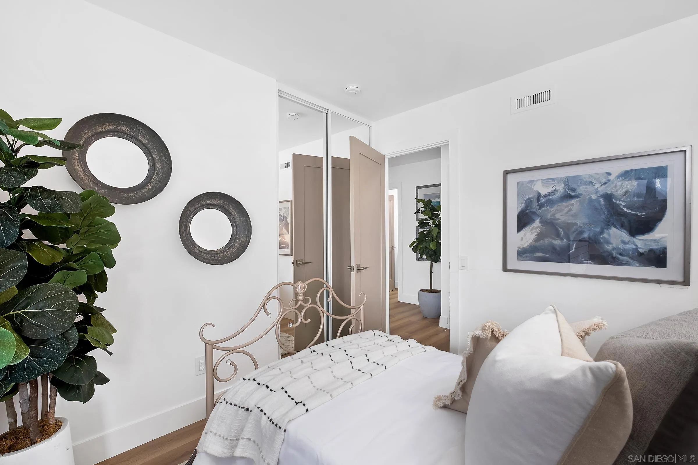 4436 Point Vicente Oceanside, CA 92058 - Photo 16 of 23 a bedroom with a bed and a chandelier