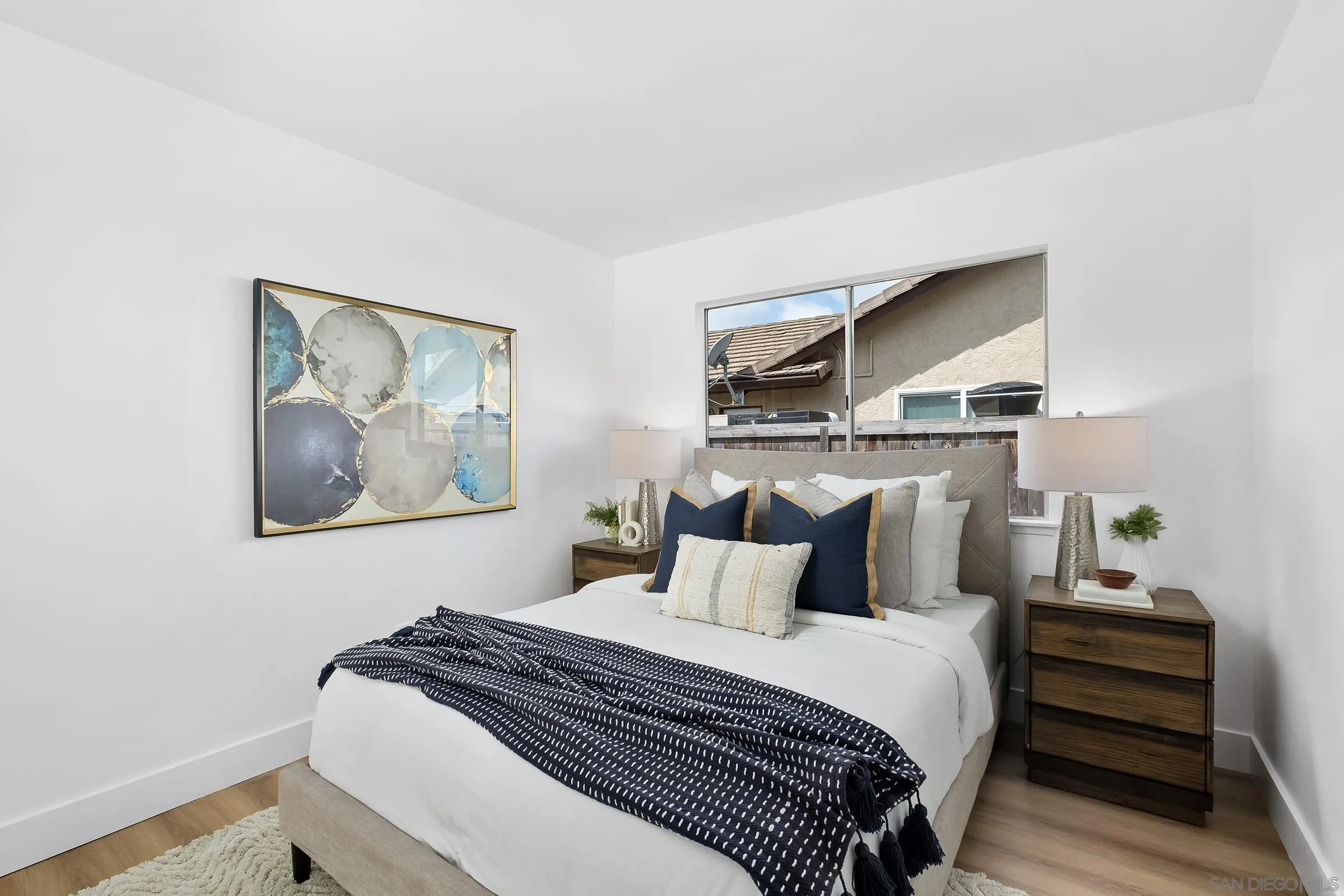 4436 Point Vicente Oceanside, CA 92058 - Photo 17 of 23 a bedroom with a bed and painting on the wall