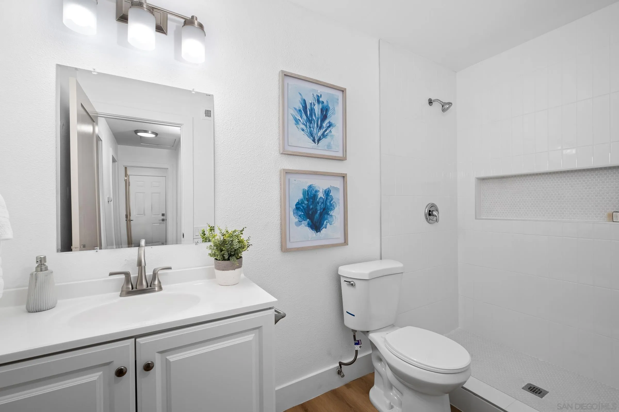 4436 Point Vicente Oceanside, CA 92058 - Photo 19 of 23 a bathroom with a sink toilet and a mirror
