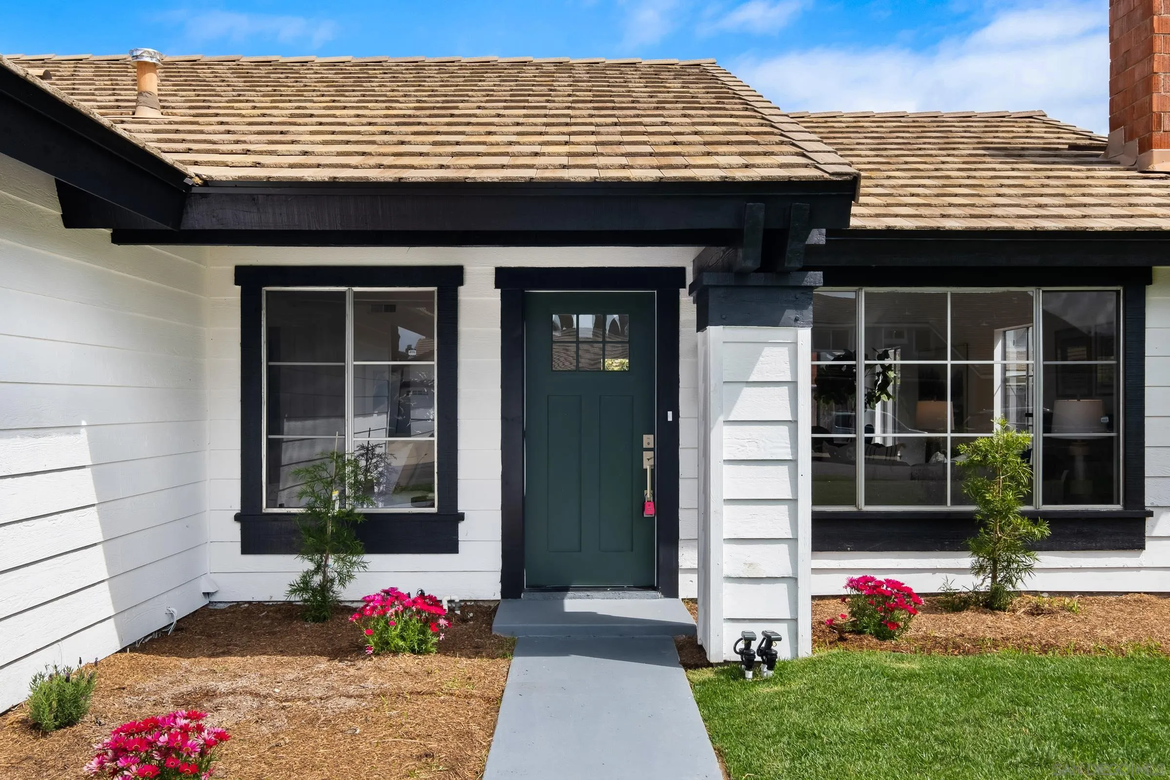 4436 Point Vicente Oceanside, CA 92058 - Photo 3 of 23 a front view of a house with a yard
