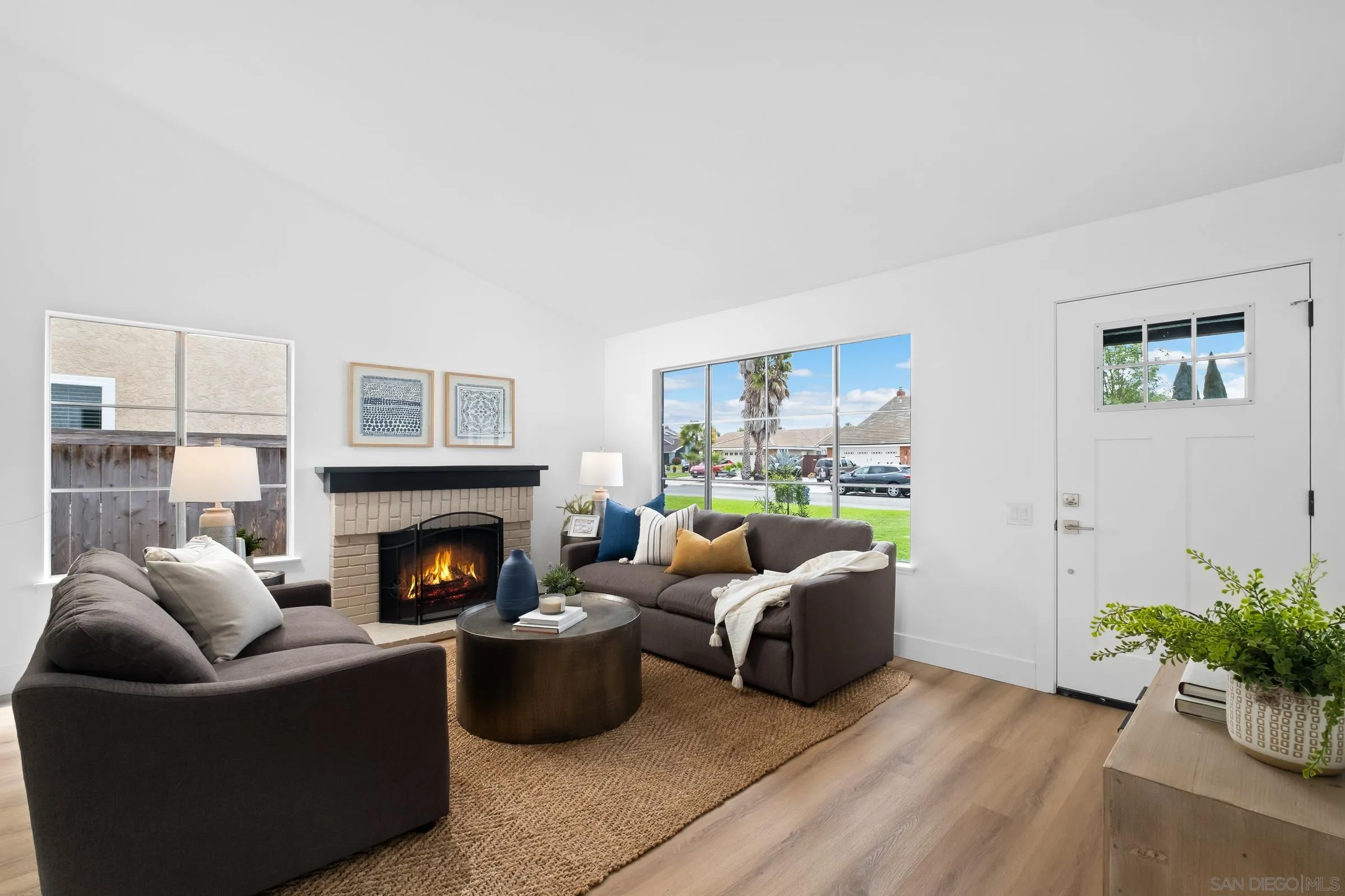 4436 Point Vicente Oceanside, CA 92058 - Photo 4 of 23 a living room with furniture and a fireplace