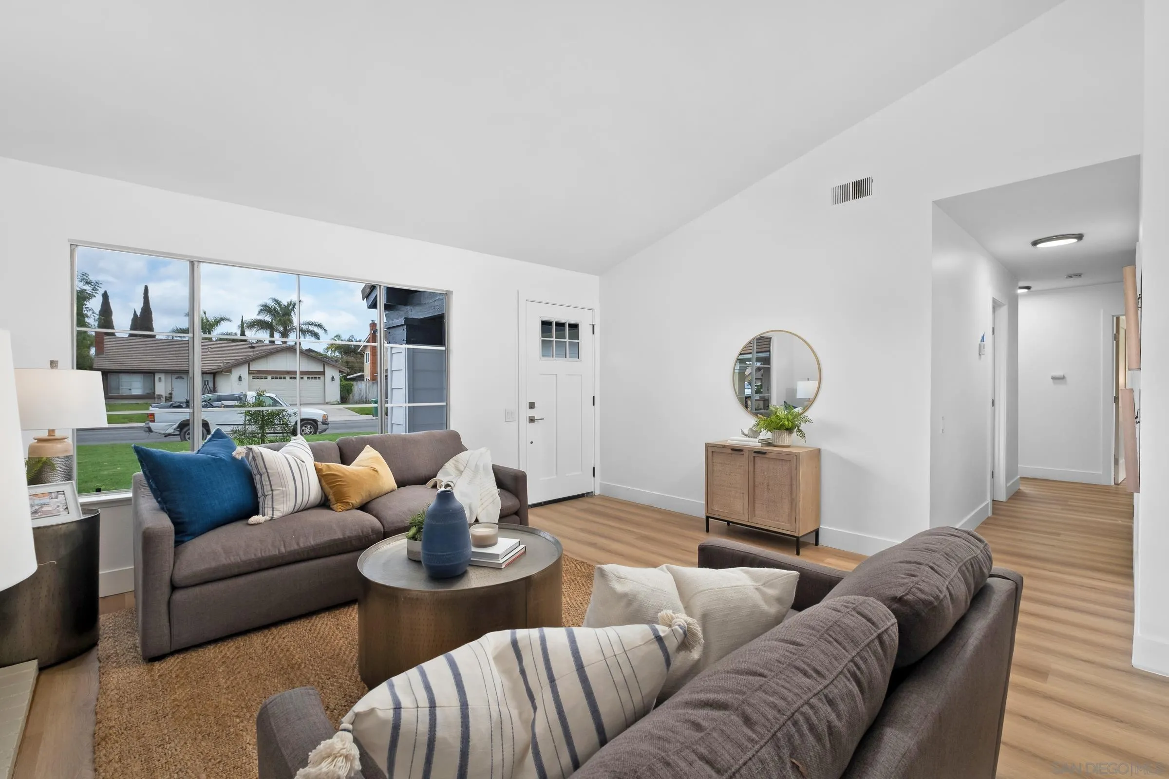 4436 Point Vicente Oceanside, CA 92058 - Photo 5 of 23 a living room with furniture and a wooden floor