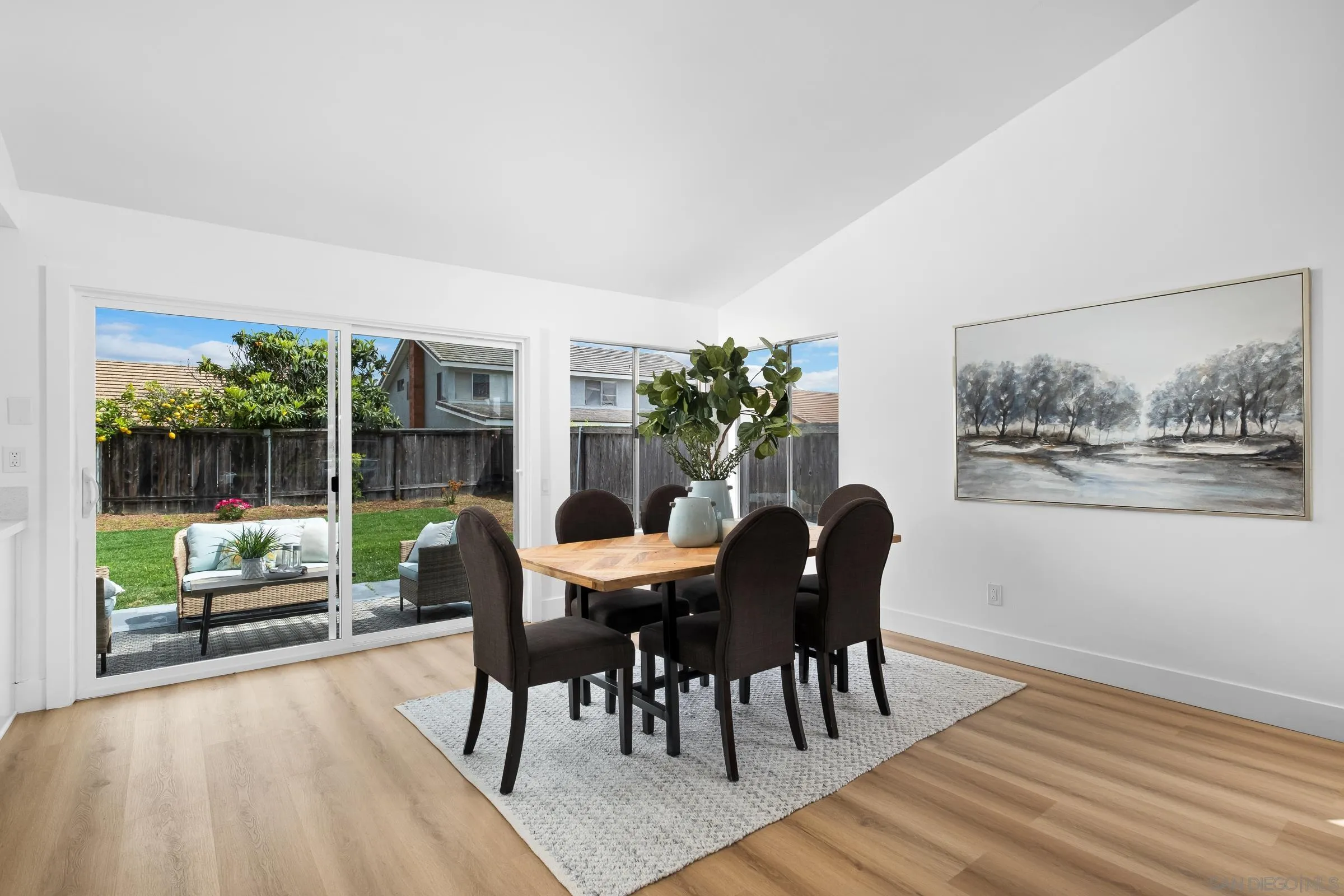 4436 Point Vicente Oceanside, CA 92058 - Photo 7 of 23 a dining room with furniture and wooden floor