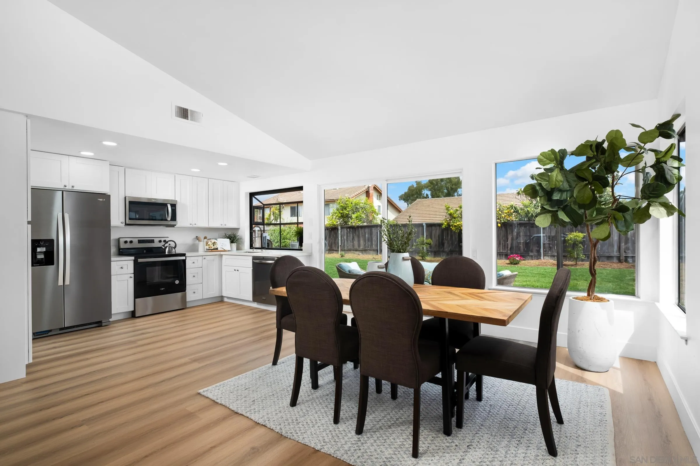 4436 Point Vicente Oceanside, CA 92058 - Photo 8 of 23 a view of a dining room with furniture window and wooden floor