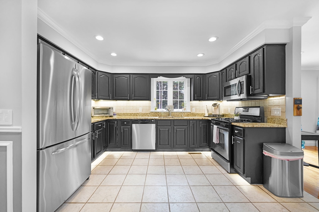 489 Main Street Acushnet, MA 02743 - Photo 13 of 37 a kitchen with stainless steel appliances granite countertop a refrigerator and a stove top oven