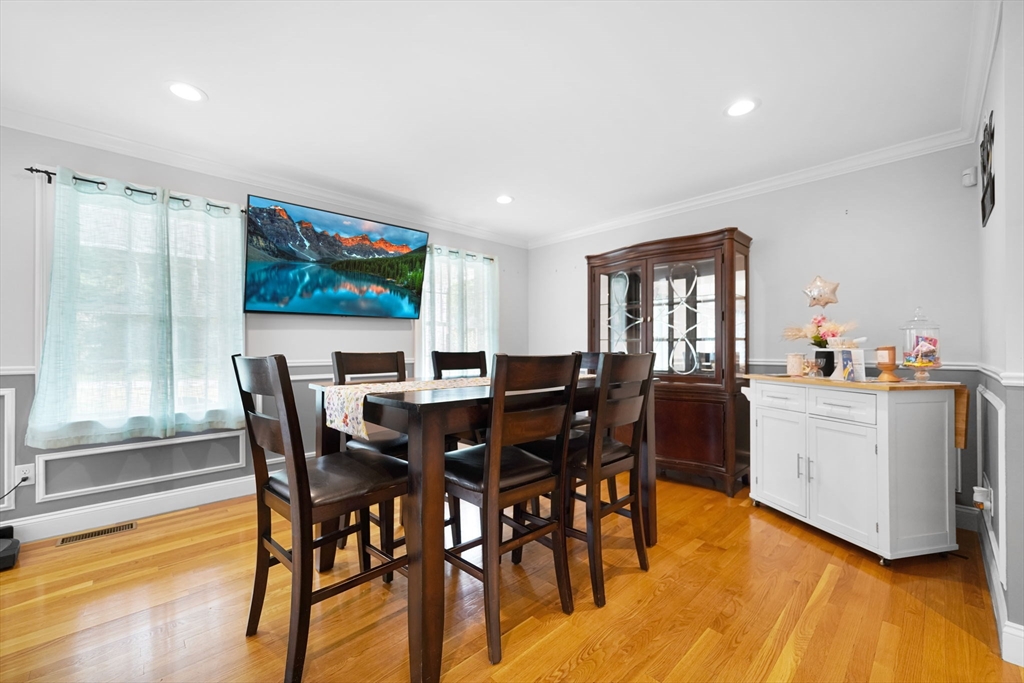 489 Main Street Acushnet, MA 02743 - Photo 15 of 37 a view of a dining room with furniture and wooden floor