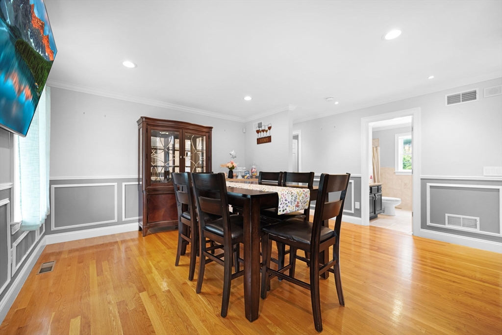 489 Main Street Acushnet, MA 02743 - Photo 16 of 37 a view of a dining room with furniture and wooden floor