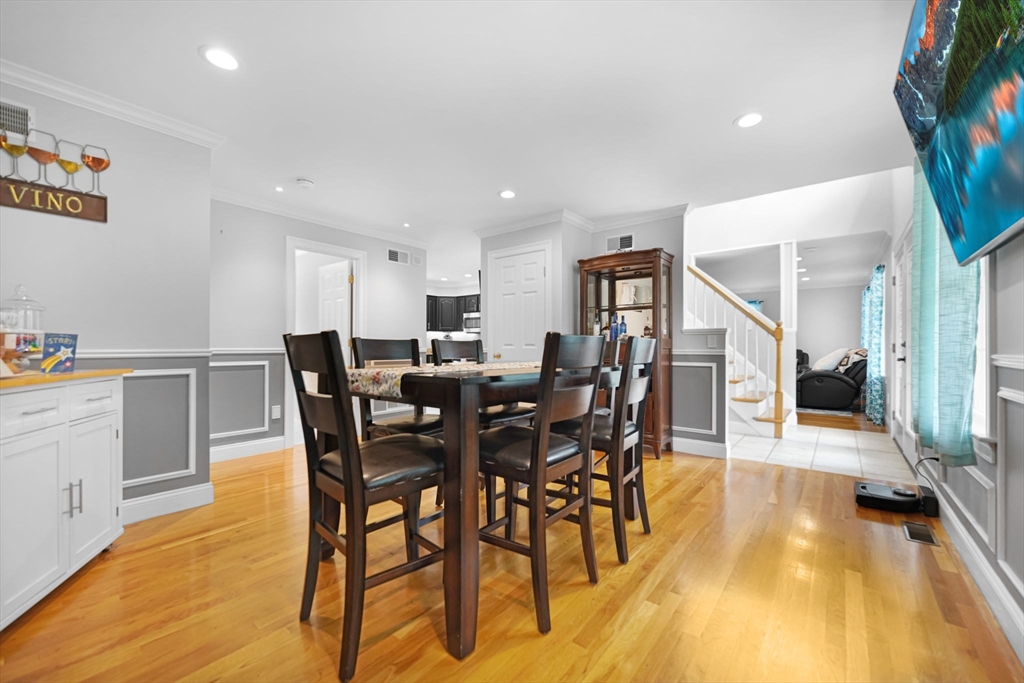 489 Main Street Acushnet, MA 02743 - Photo 17 of 37 a view of a dining room with furniture and wooden floor