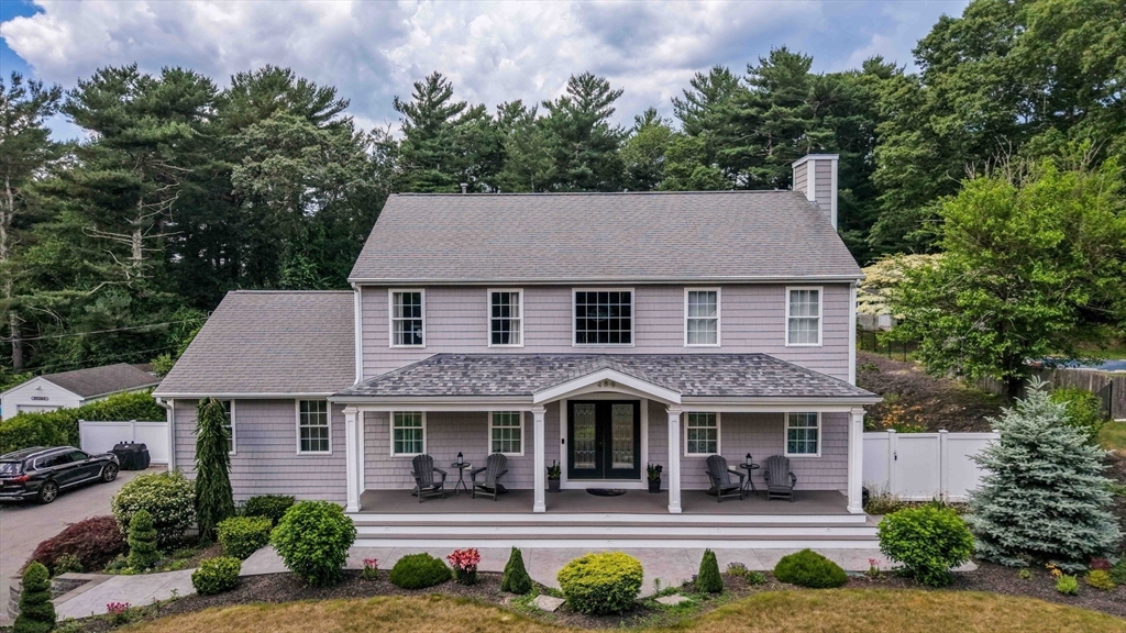 489 Main Street Acushnet, MA 02743 - Photo 2 of 37 a aerial view of a house with a yard and potted plants