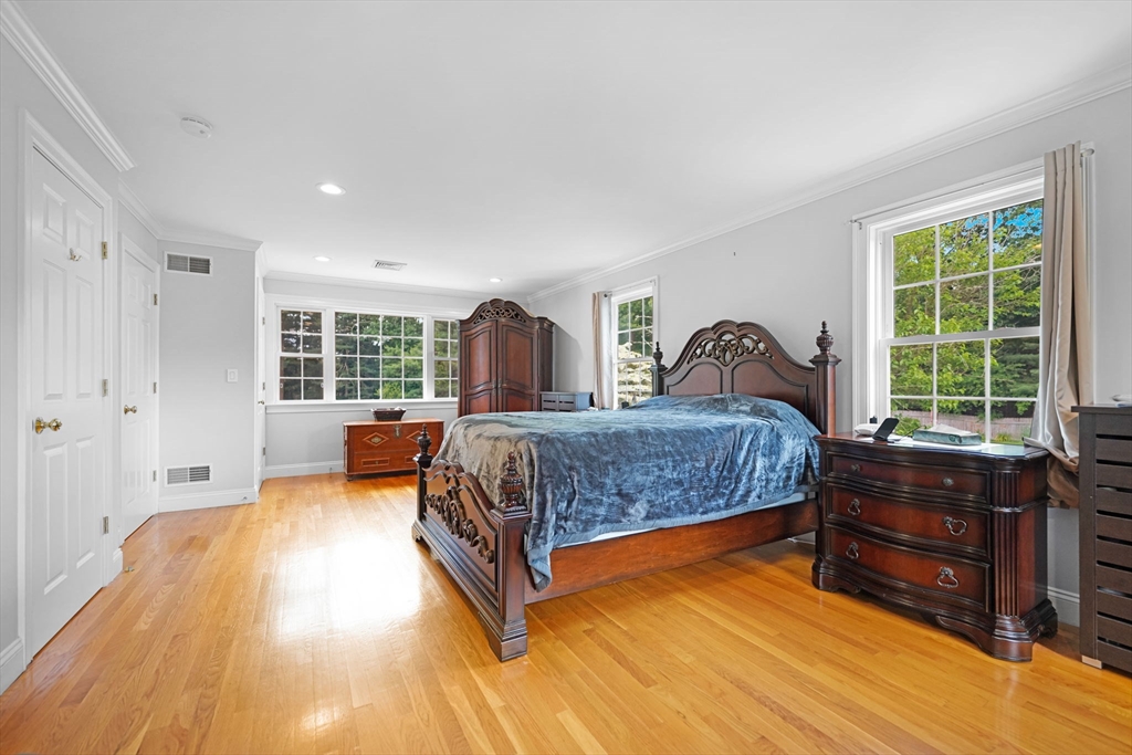 489 Main Street Acushnet, MA 02743 - Photo 27 of 37 a bedroom with a bed and wooden floor