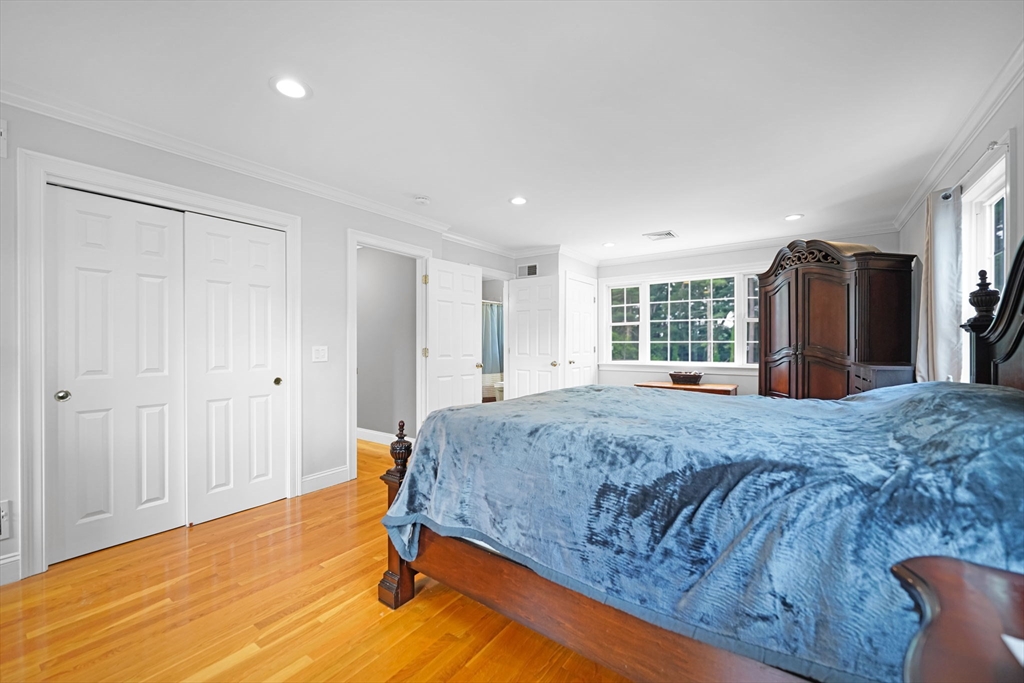 489 Main Street Acushnet, MA 02743 - Photo 28 of 37 a bedroom with a bed closet and a large window