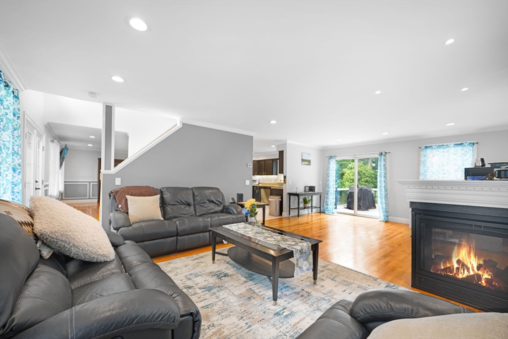 489 Main Street Acushnet, MA 02743 - Photo 9 of 37 a living room with furniture and a fireplace