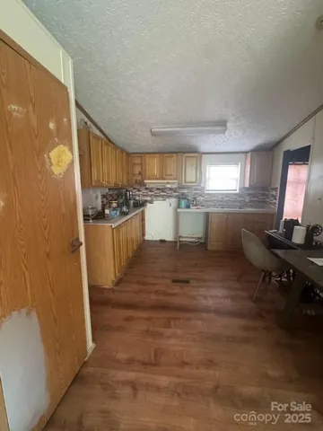 a kitchen with a sink and wooden cabinets
