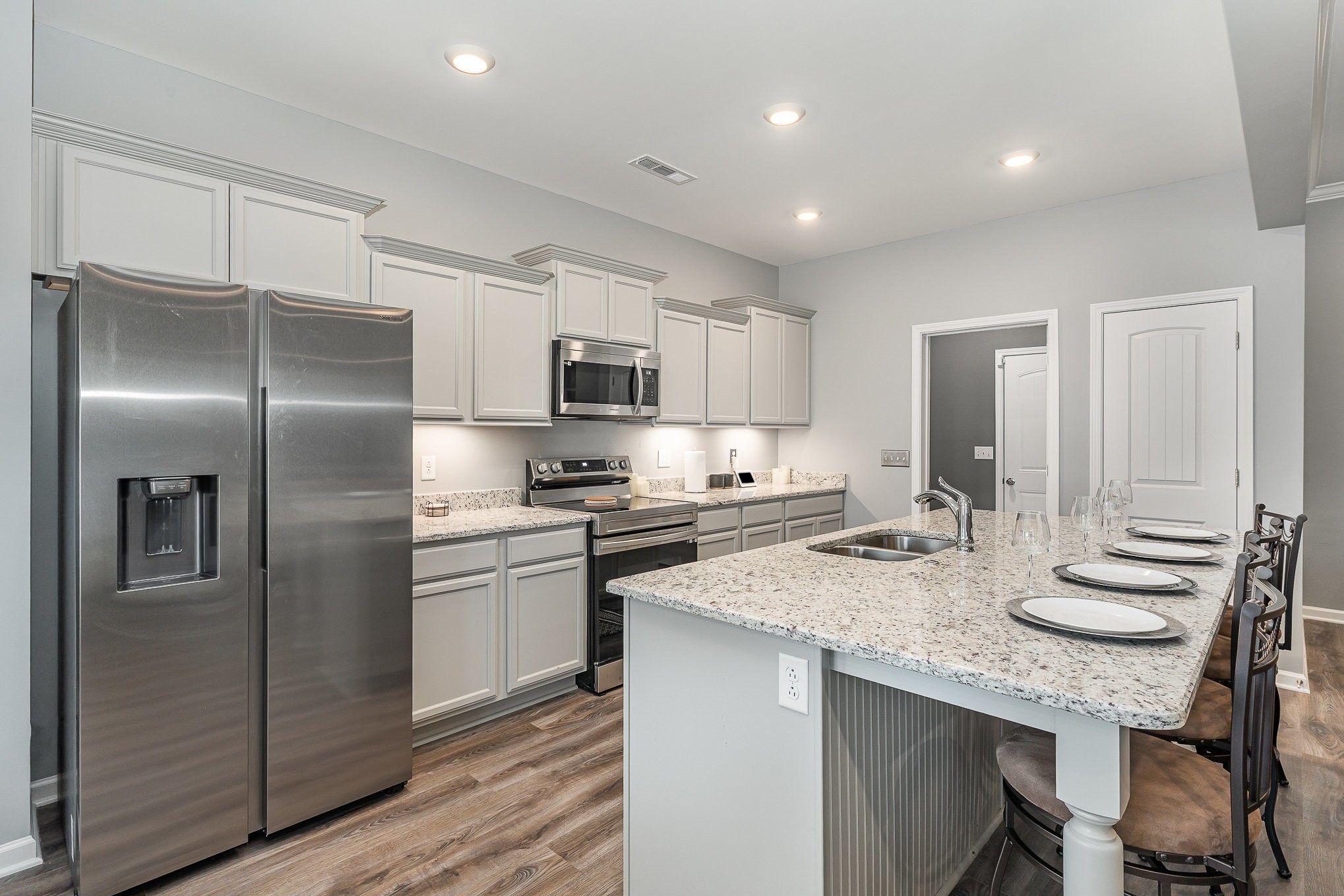 248 Ruby Cate Way Murfreesboro, TN 37128 - Photo 12 of 29 a kitchen with kitchen island granite countertop a sink cabinets and stainless steel appliances