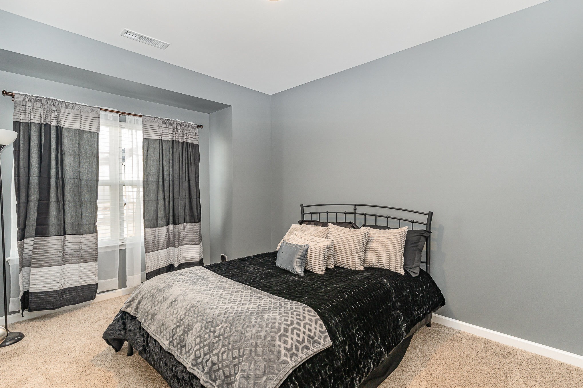 248 Ruby Cate Way Murfreesboro, TN 37128 - Photo 19 of 29 a bedroom with a bed and a window