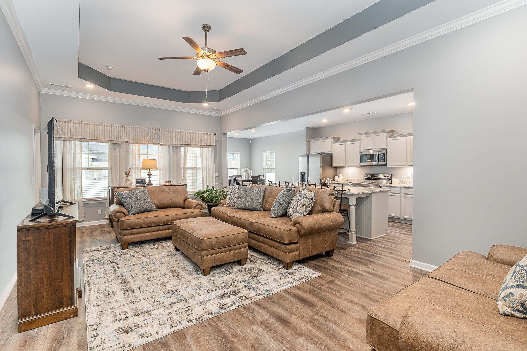 248 Ruby Cate Way Murfreesboro, TN 37128 - Photo 2 of 29 a living room with furniture kitchen view and a chandelier