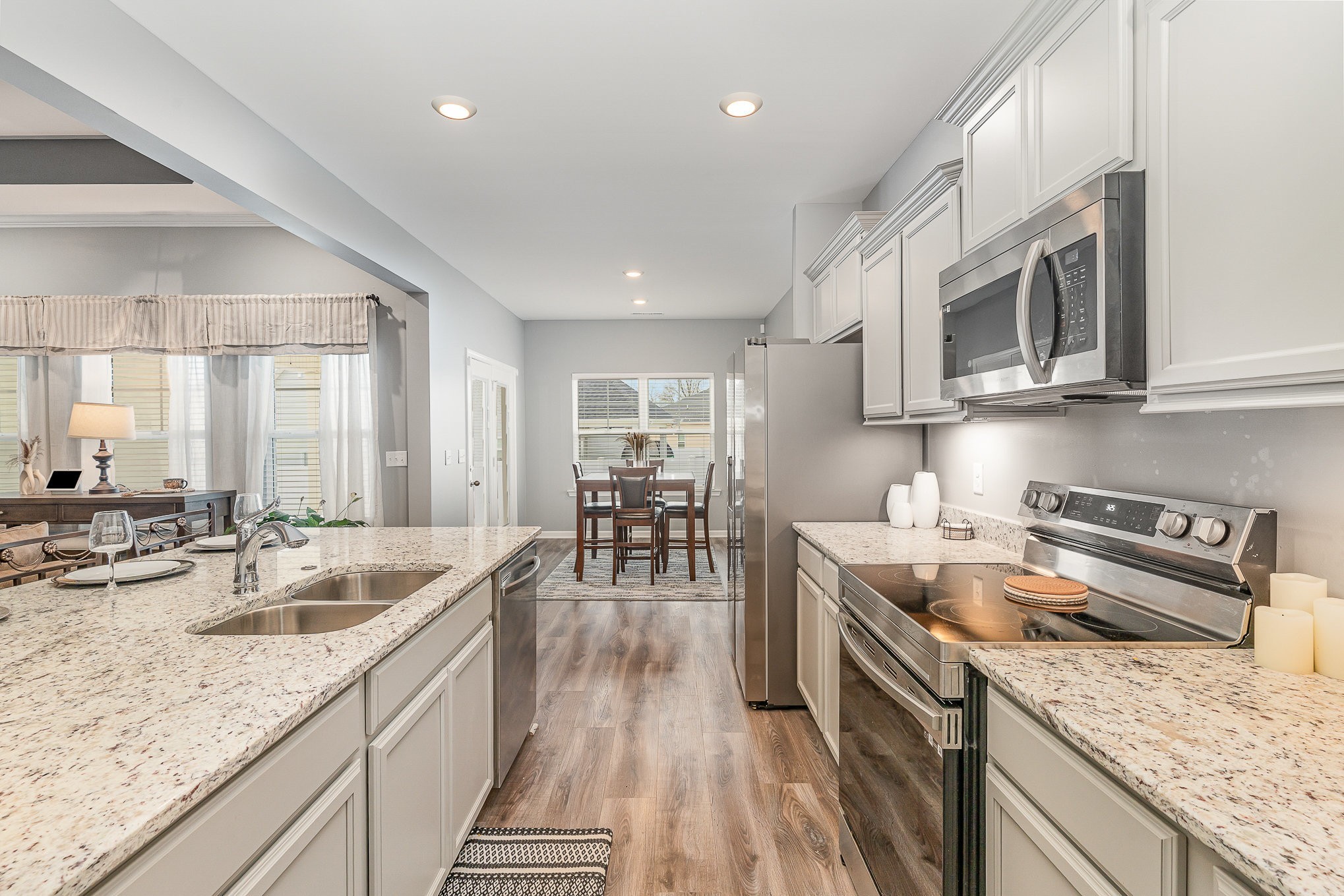248 Ruby Cate Way Murfreesboro, TN 37128 - Photo 10 of 29 a kitchen with stainless steel appliances granite countertop a sink stove and cabinets
