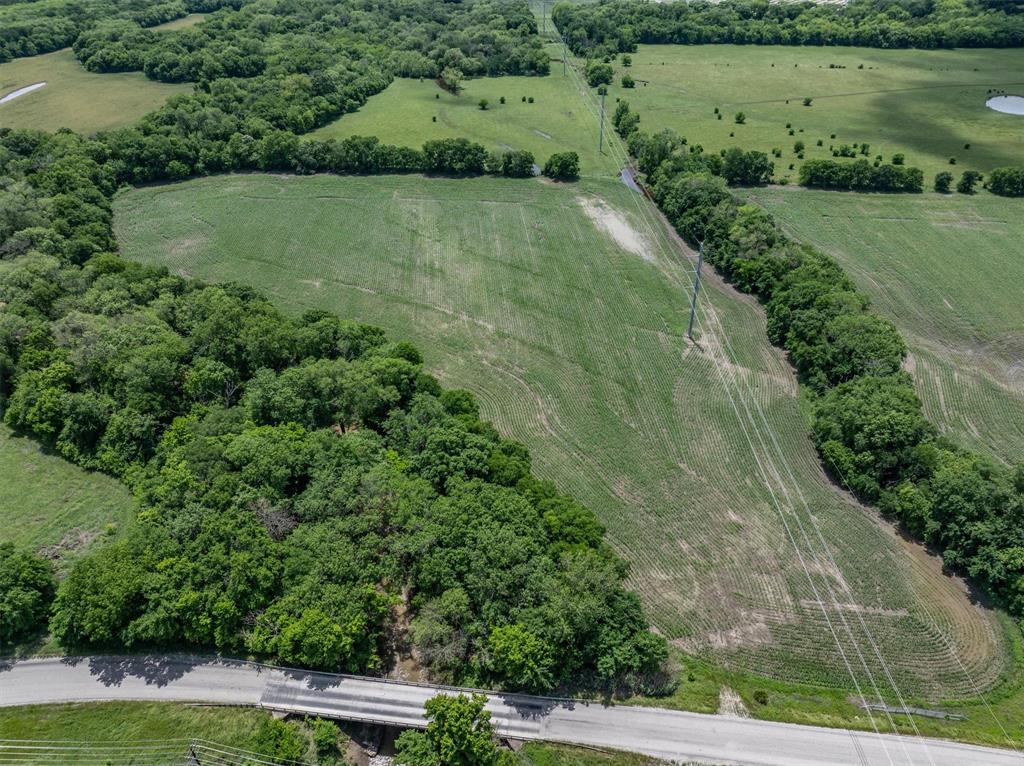 Tbd Cowan Road Celina, TX 75009 - Photo 13 of 31 an aerial view of green landscape with trees houses and lake view