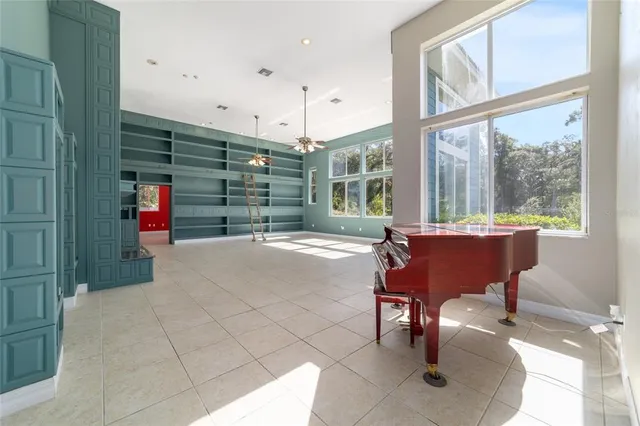 a kitchen with stainless steel appliances kitchen island granite countertop a refrigerator and a sink