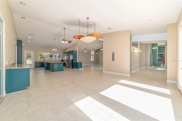 a view of a livingroom with a piano and wooden floor