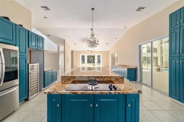 a view of a livingroom with a ceiling fan and window