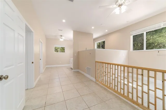 a kitchen with granite countertop a refrigerator oven a sink a stove and a cabinets