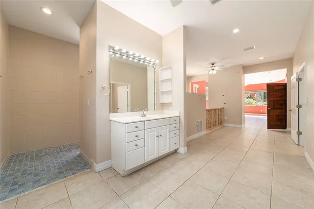 a view of a bathroom from a hallway