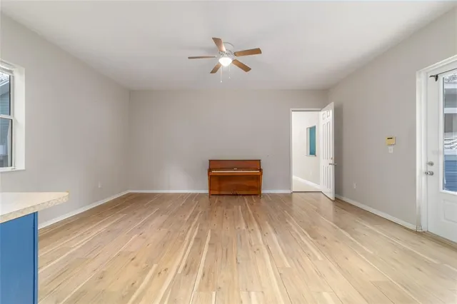 an aerial view of a houses with a yard