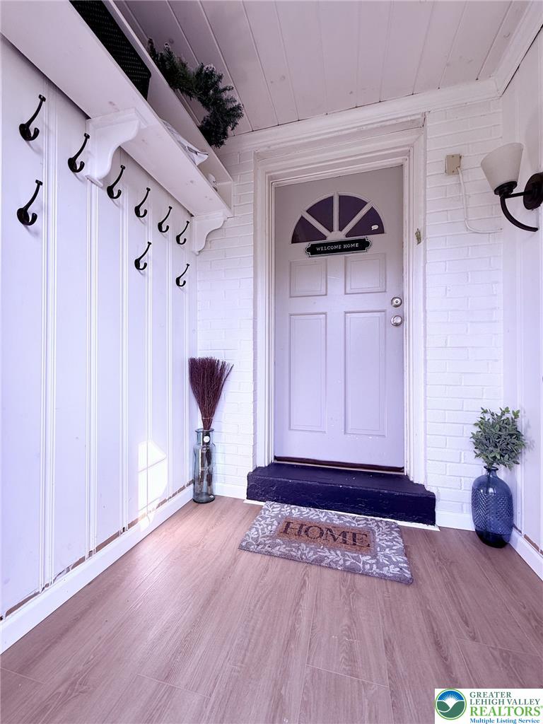 1275 Macada Road Bethlehem, PA 18017 - Photo 18 of 87 a view of a hallway with wooden floor and a ceiling fan