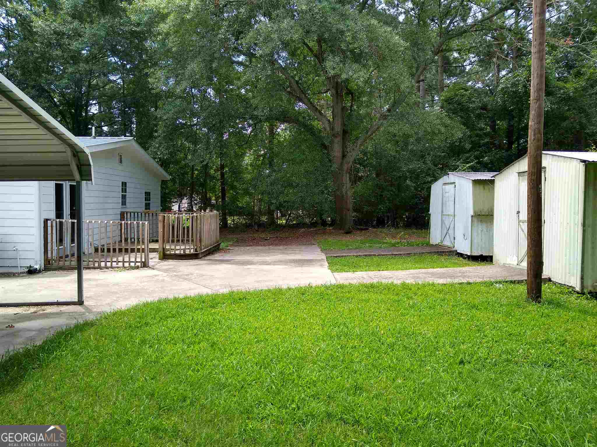 113 Maple Street Hartwell, GA 30643 - Photo 12 of 13 a view of a house with backyard and a tree