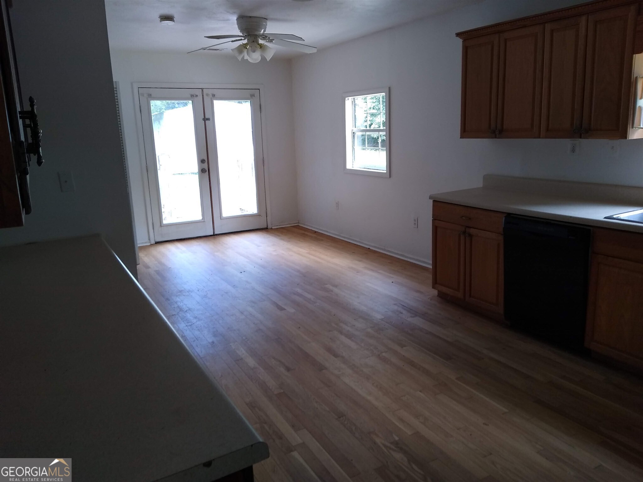 113 Maple Street Hartwell, GA 30643 - Photo 5 of 13 wooden floor in an empty room with a window