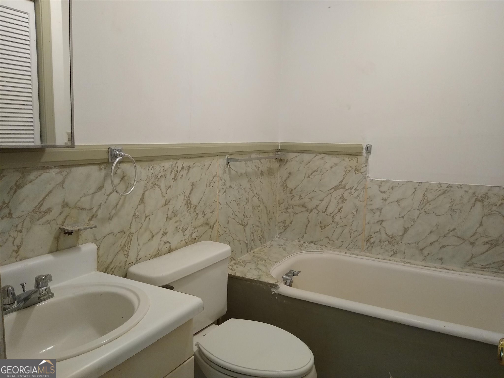 113 Maple Street Hartwell, GA 30643 - Photo 7 of 13 a bathroom with a sink and a bathtub