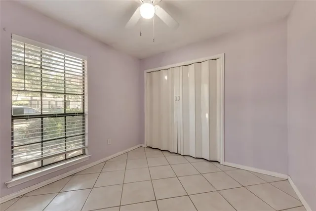 a bathroom with a granite countertop sink a toilet a mirror and shower