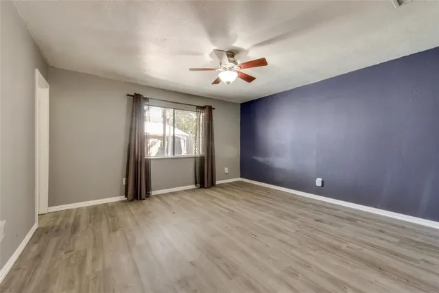 a view of a house with pool and sitting area
