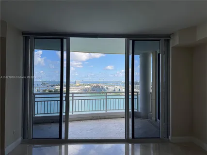 a view of a glass door and a porch